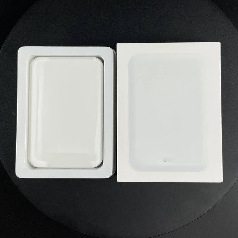 White magnetic wireless charging power bank with 5000mAh capacity on a table.