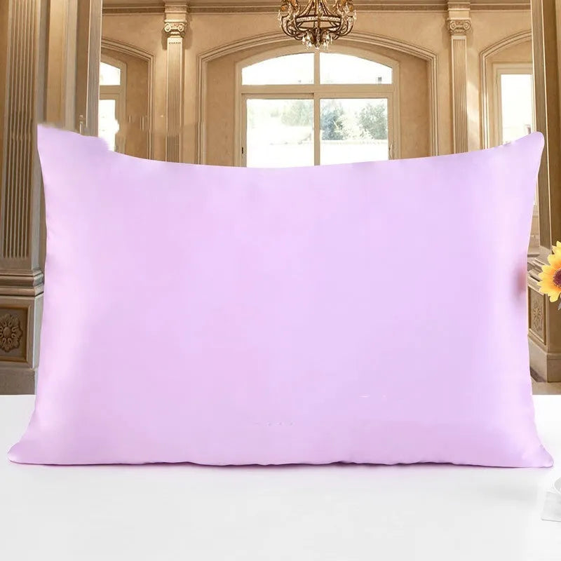 19 M double-sided silk pillowcase shown in one of 14 available colours, including apricot, sky blue, and black.