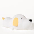 Cute two-colour cartoon dog silicone night lamp with USB cable for power.