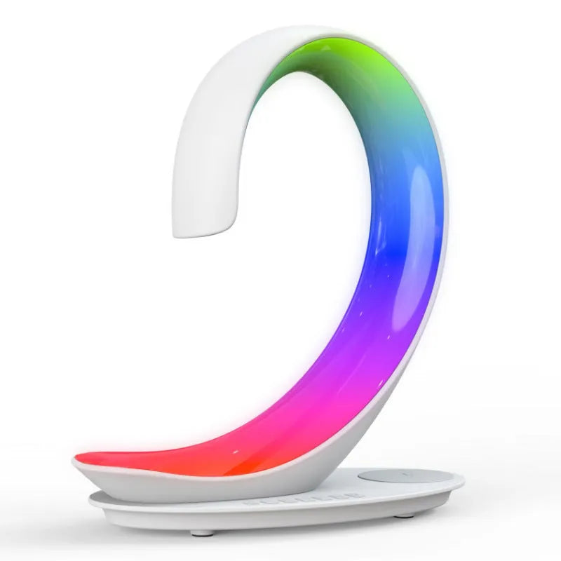 White swan-shaped desktop wireless charger with Bluetooth speaker and colourful atmosphere lighting