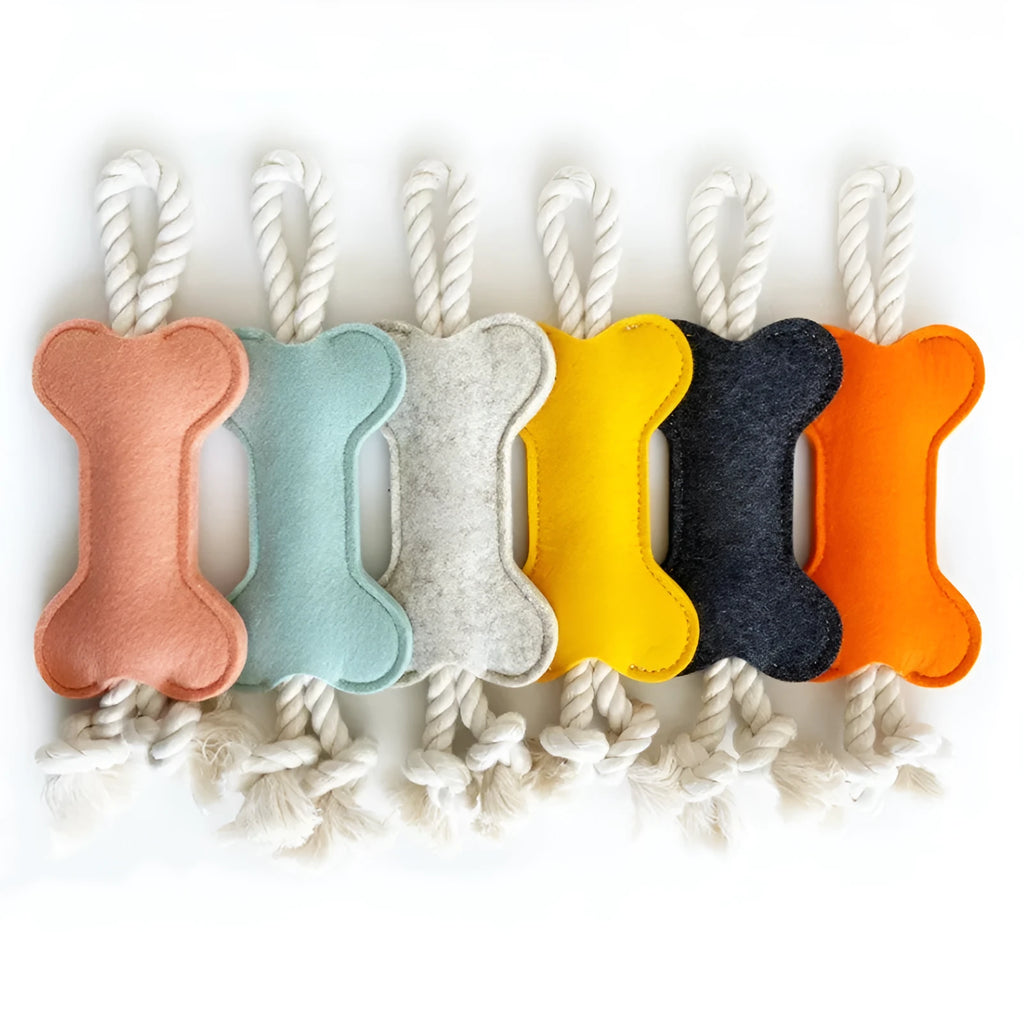 Blue bone-shaped dog chew toy made of felt fabric with visible rope knots.