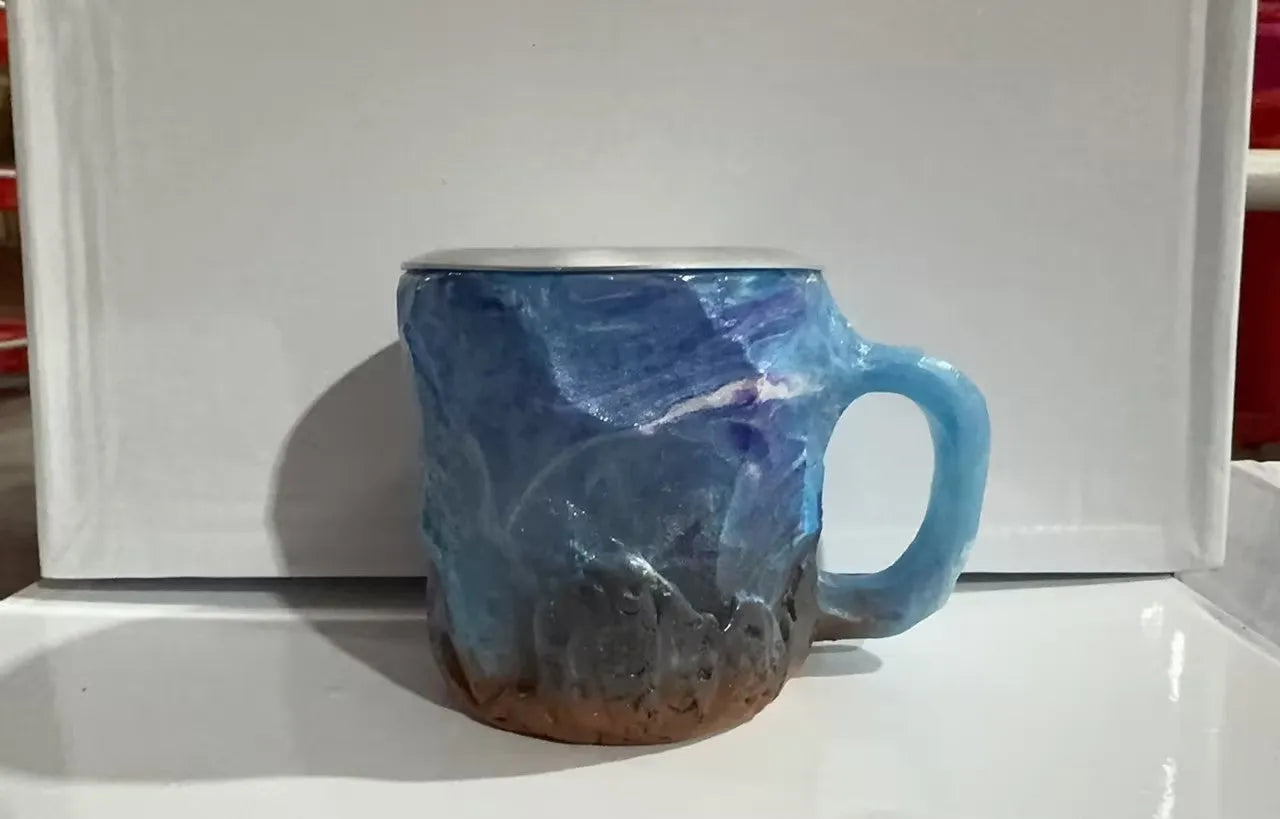 Purple resin mineral crystal coffee mug with handle showing 3D texture and 10cm height