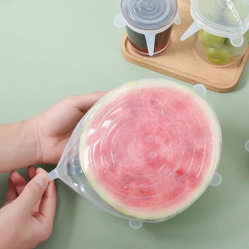 Set of six colourful silicone stretch lids in different sizes for covering food containers.