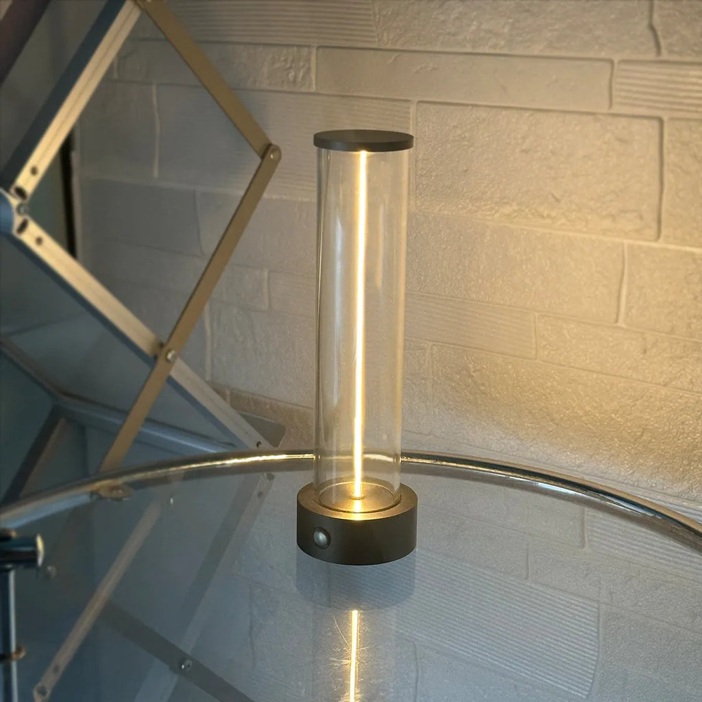 Slim warm white LED light strip with magnetic base for USB charging and attachment to metal surfaces.