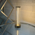 Slim warm white LED light strip with magnetic base for USB charging and attachment to metal surfaces.