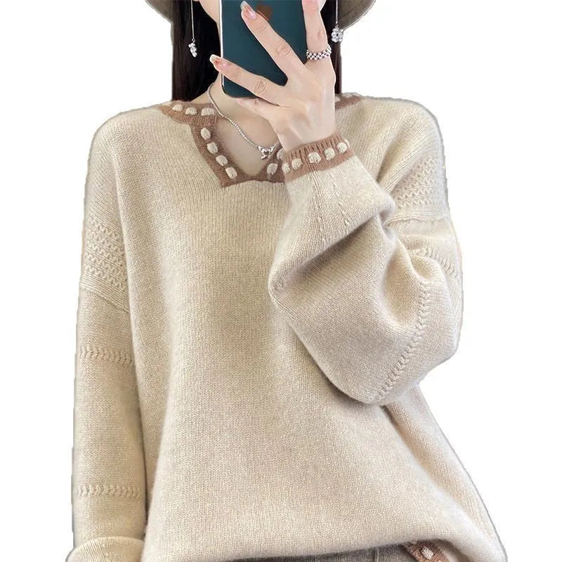 Women's camel-coloured V-neck long sleeve viscose sweater laid flat.