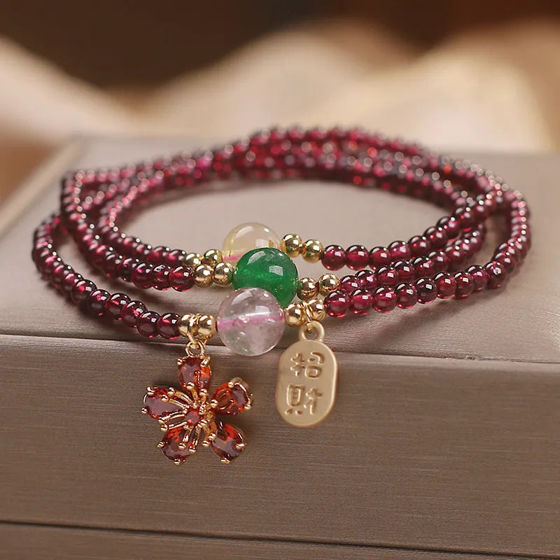 Natural crystal bracelet in pomegranate red and cherry blossom colours with sequin bead accents for women