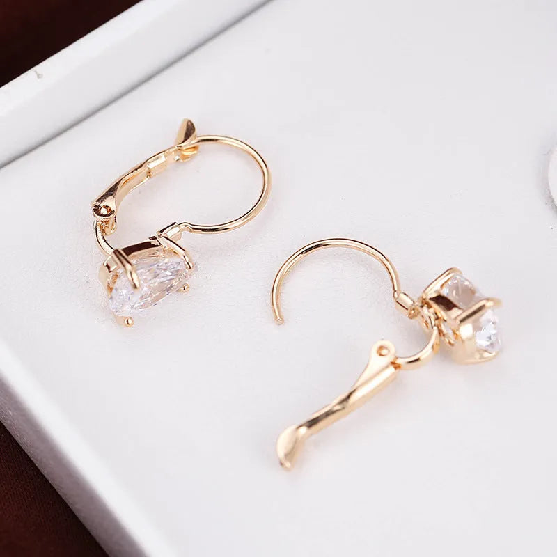 Women's drop-shaped copper earrings with platinum/kplatinum inlaid gems in gold or platinum colour