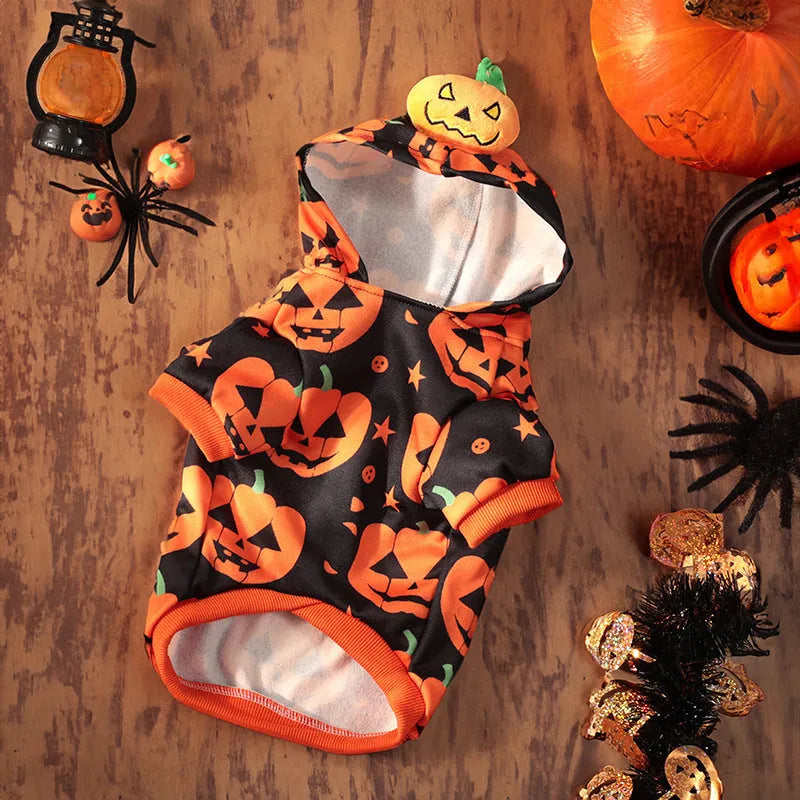 A dog wearing a crystal velvet Halloween pumpkin skirt costume, showing the soft fabric and festive design.