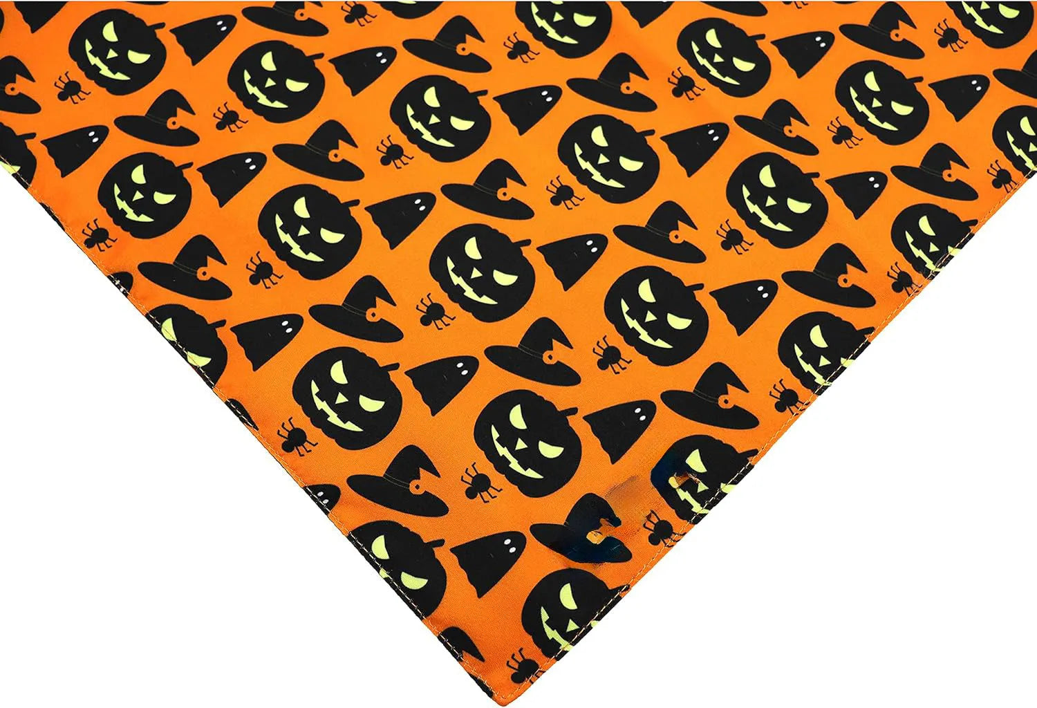 Black and orange reversible Halloween dog bandana with pumpkin and spider web patterns on a dog.