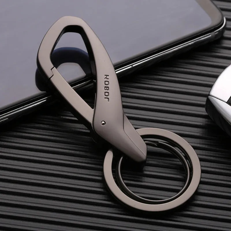 Black zinc alloy car key chain with two metal rings and a waist-hanging clip.