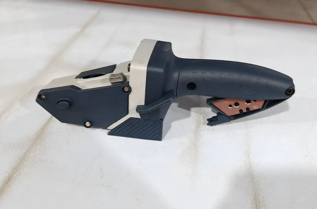 Blue multifunctional woodworking cutter with one-press lock for cutting gypsum, foam, cardboard, and KT board.