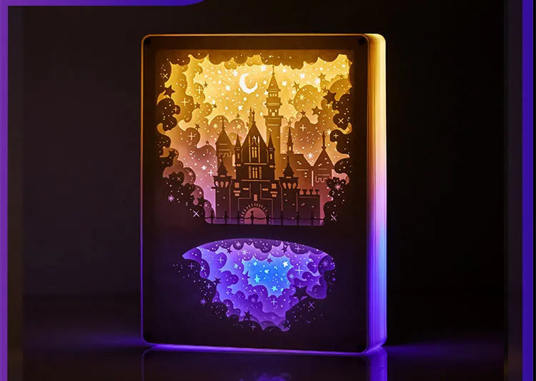 Modern bedside night light with three-dimensional paper carving design showing yellow illumination through ABS and acrylic frame
