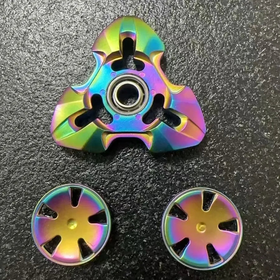 Alloy metal rotating fingertip gyro decompression toy in gun colour and colourful options.