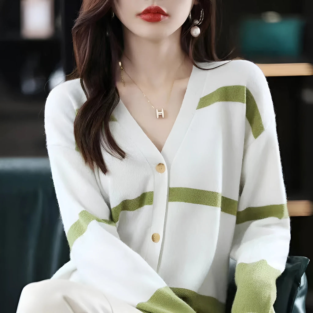 Women's striped V-neck knitted cardigan buttoned up, showcasing its slim fit and 3D pattern texture.