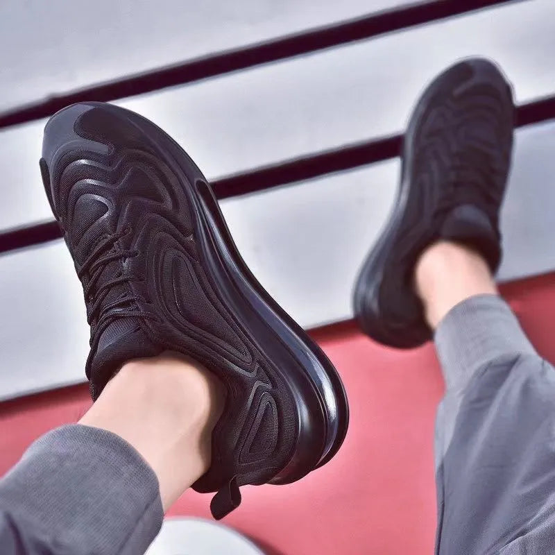Men's black casual lace-up sneakers with a thick sole and round toe, shown on a white background.