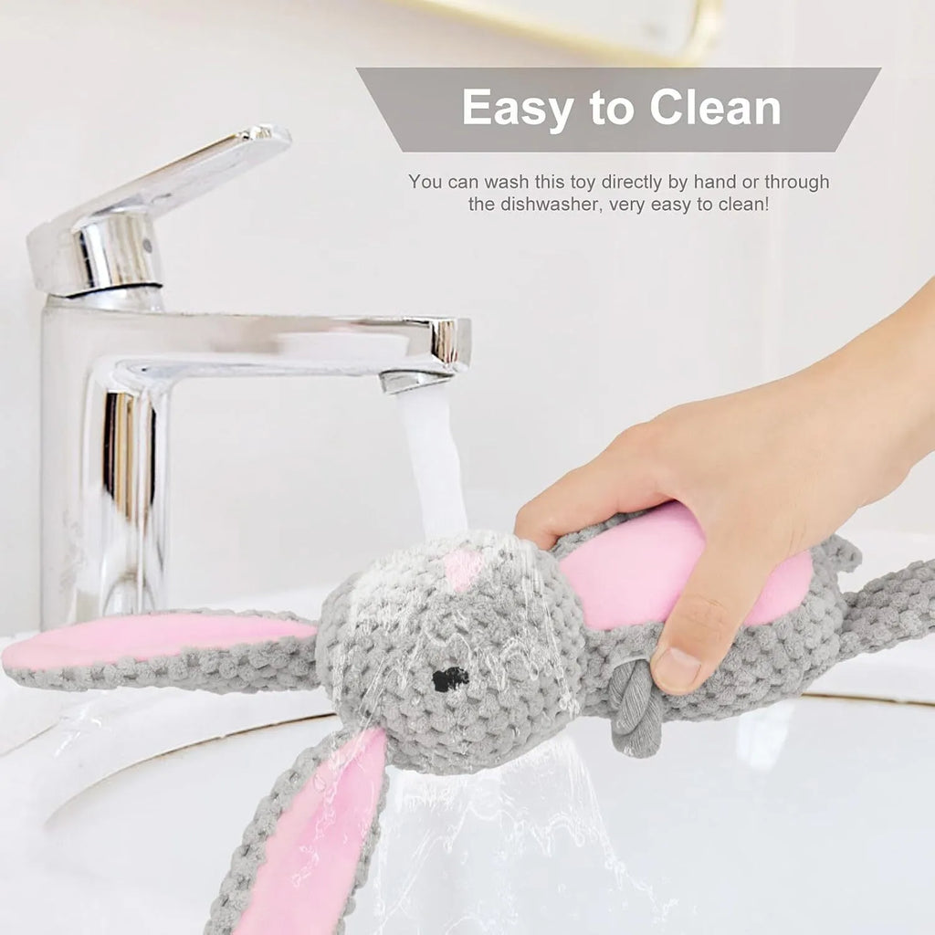 Soft plush dog toy shaped like an animal with an attached cotton rope, featuring a squeaker and crinkle paper inside.