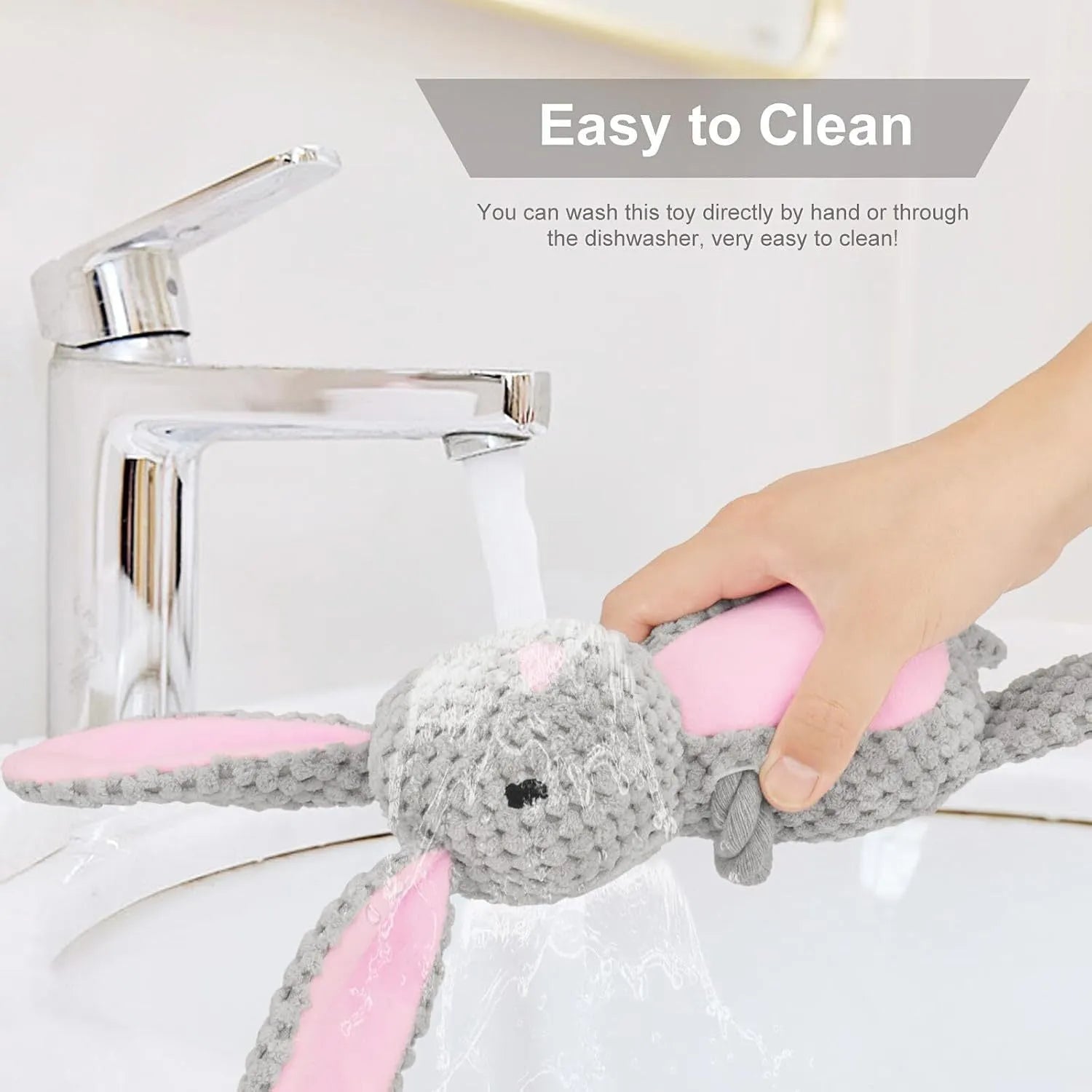 Soft plush dog toy shaped like an animal with an attached cotton rope, featuring a squeaker and crinkle paper inside.