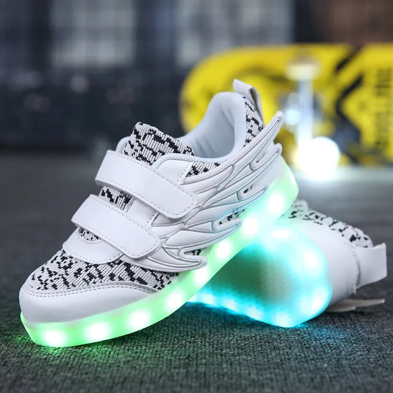Children's plum red and white LED light-up sneakers with USB charging port visible.