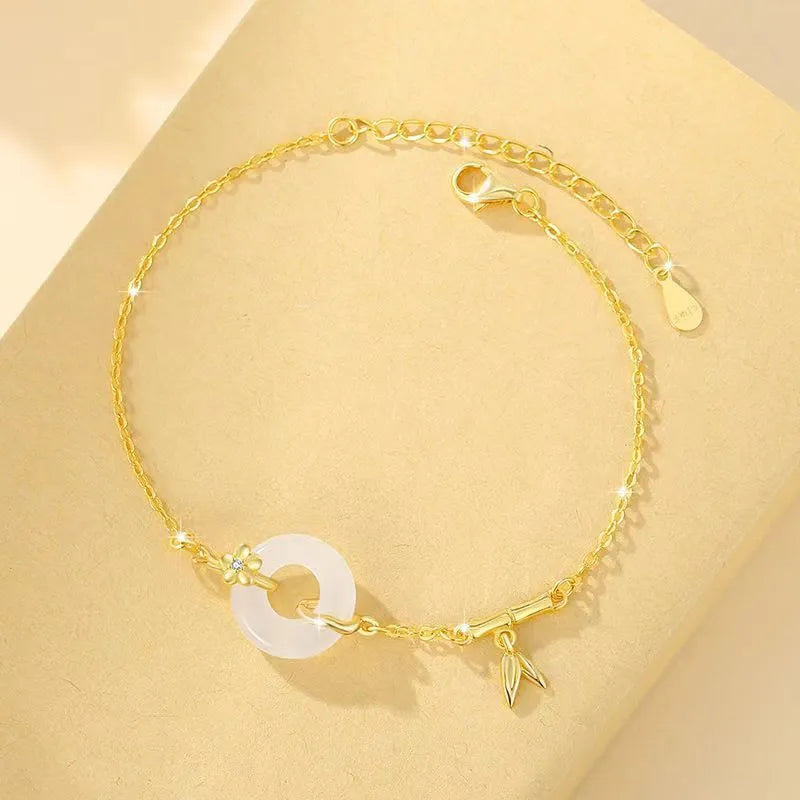 Women's silver bracelet with white chalcedony peace buckle charm and starry sky design