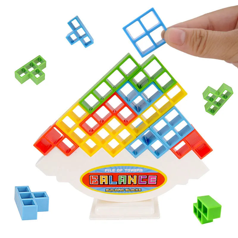 Plastic balance stacking game with colourful blocks, chassis, and base in packaging.