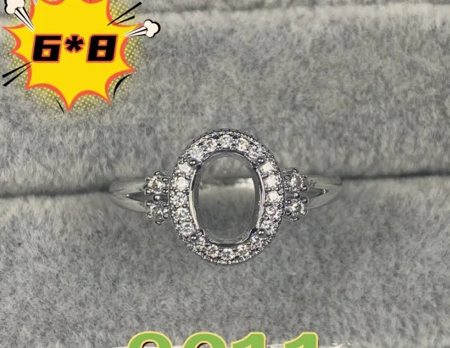 Oval denier ring with 6x8mm stone and five-pointed star detail on electroplated copper band