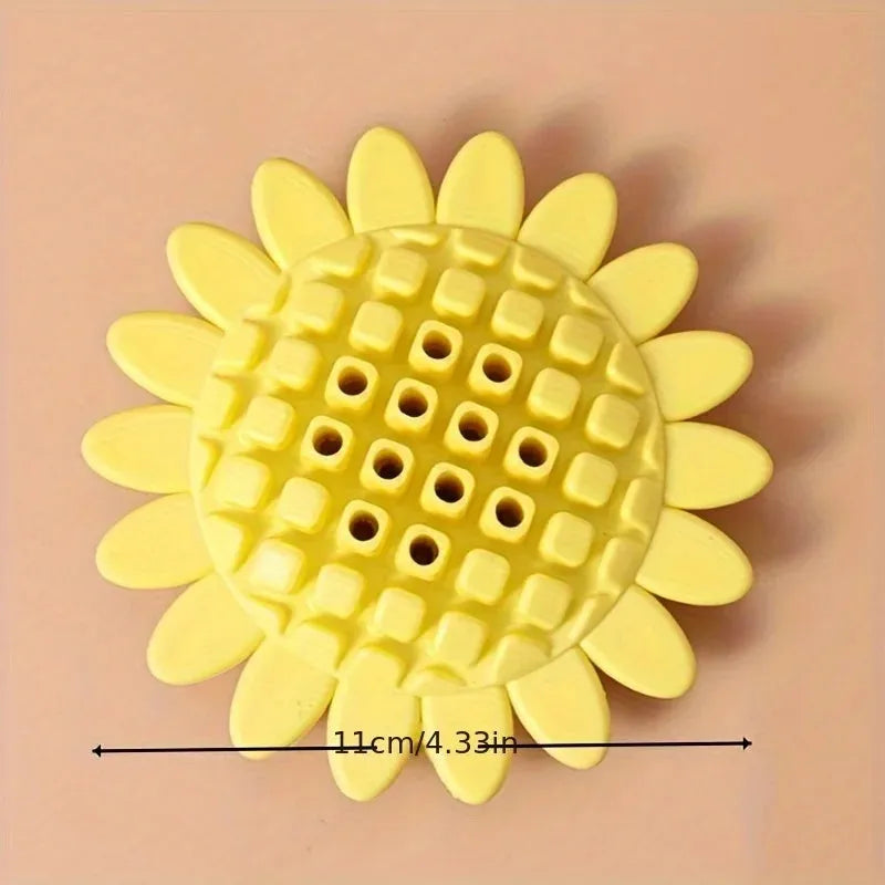 Yellow rubber sunflower dog toy for puppy teething with textured petal surface