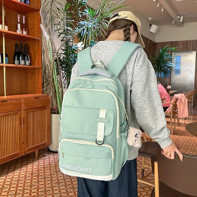 Waterproof nylon school backpack with curved shoulder straps in various colours