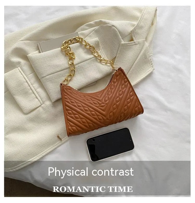 Brown pleated PU leather women's baguette shoulder bag with a chain strap and soft carry handle.