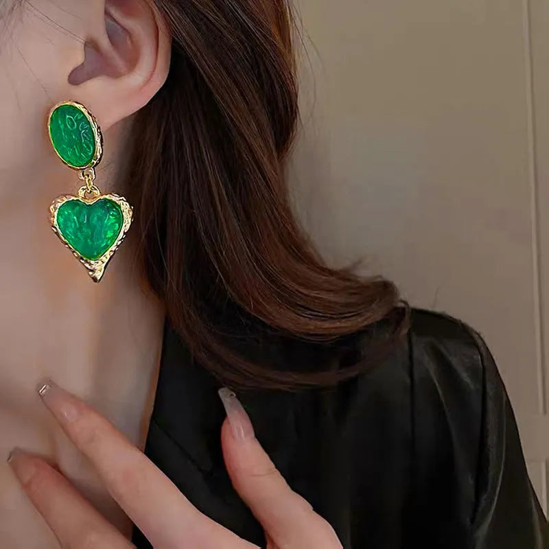Oval love heart stud earrings with pleated texture in purple, red, green, and yellow white colours.