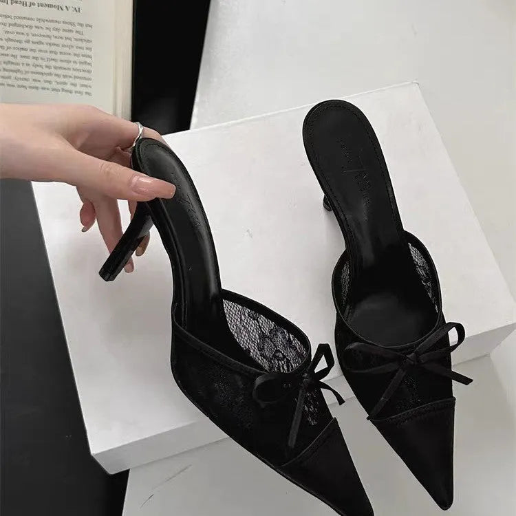 Light brown women's lace high heels with a pointed toe and a decorative bowknot on the upper.