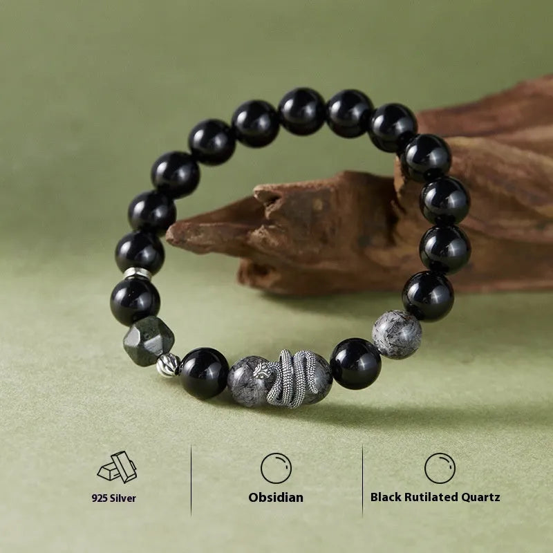 S925 sterling silver men's bracelet with black obsidian crystal and detailed snake design on a wrist.