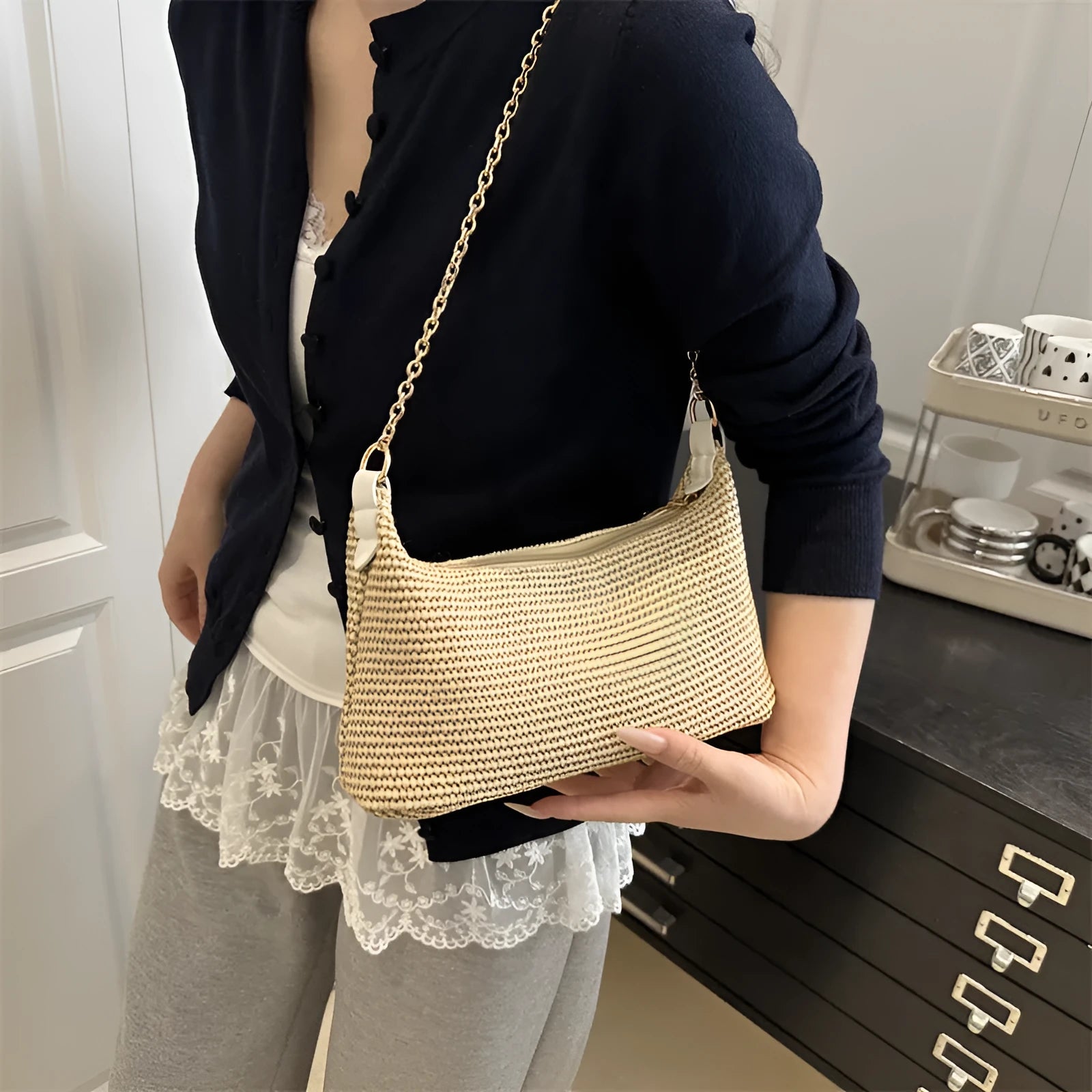 Woven straw crossbody handbag with square shape in khaki colour showing phone pocket