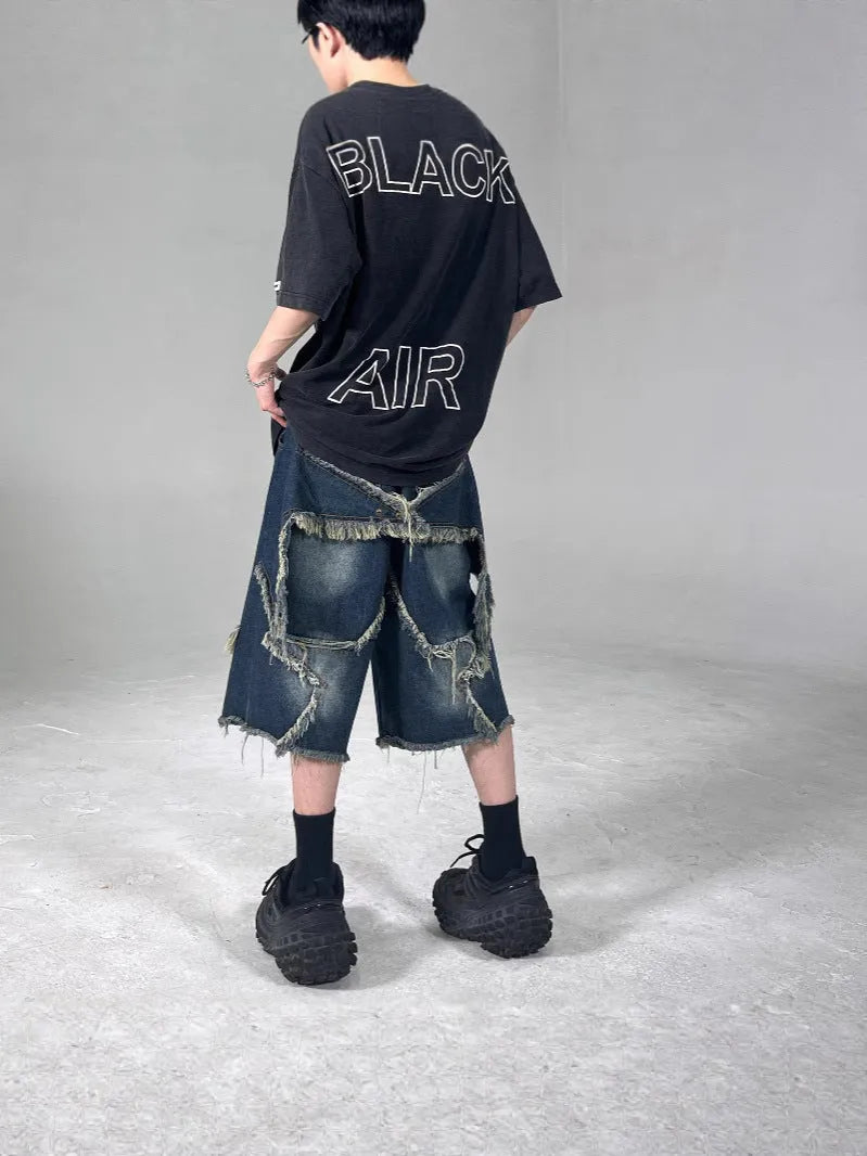 Blue retro denim shorts with frayed edges and five-pointed star decoration, loose fit style