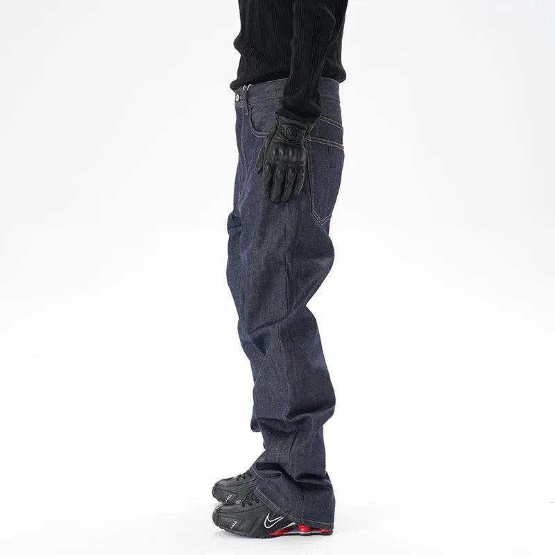 Man wearing dark blue loose straight-leg casual jeans.