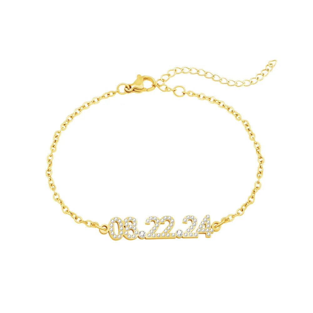 Stainless steel digital bracelet with diamond-set number display on wrist.