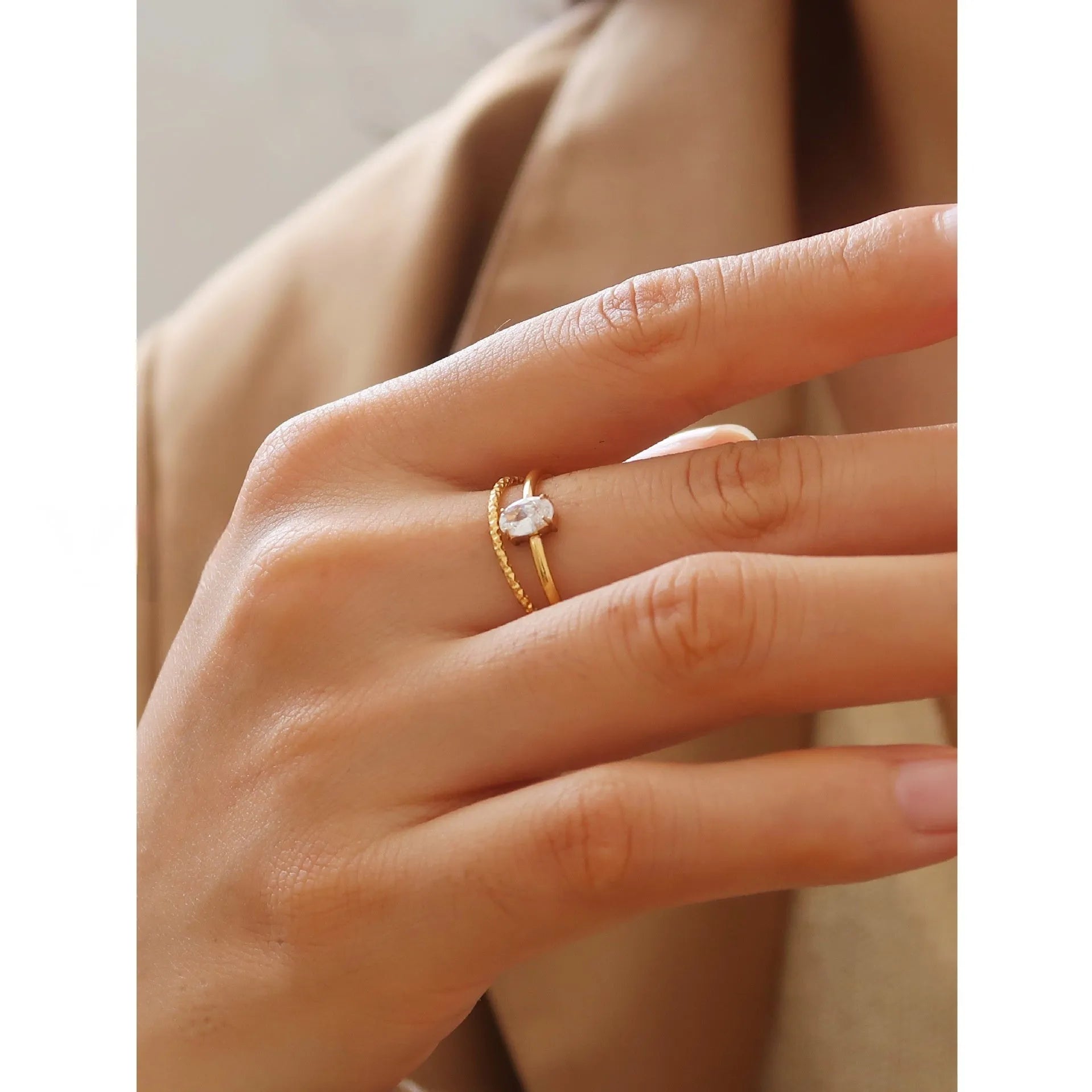 Golden heart-shaped stainless steel ring on a white background, showing its simple bracelet design and electroplated finish.