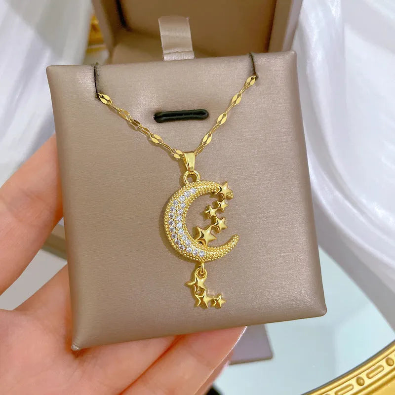 Stainless steel necklace with a geometric moon pendant and tassel chain detail.