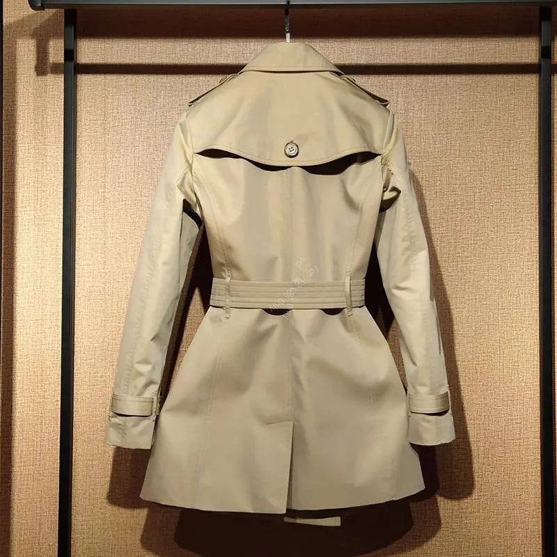 Women's khaki British double-breasted trench coat with flight sleeves on hanger