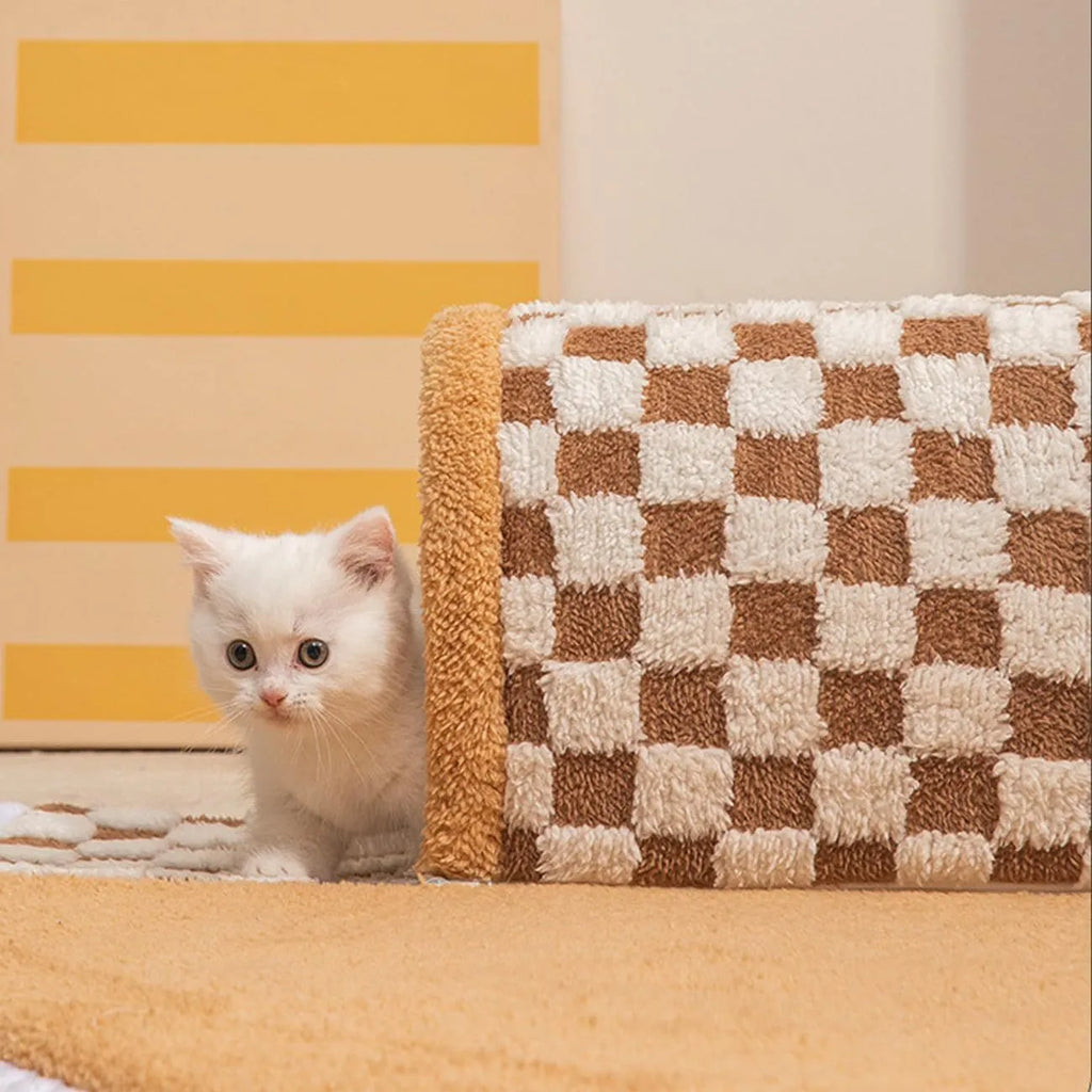 Coffee coloured plush 2-in-1 pet bed with a sleeping mat and an attached tunnel, showing anti-slip base.
