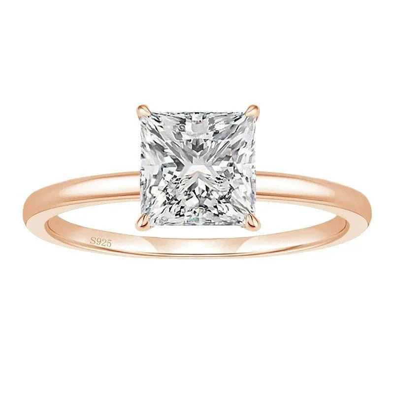 Women's simple geometric 925 sterling silver ring in gold, rose gold, or silver colour on a grey background.