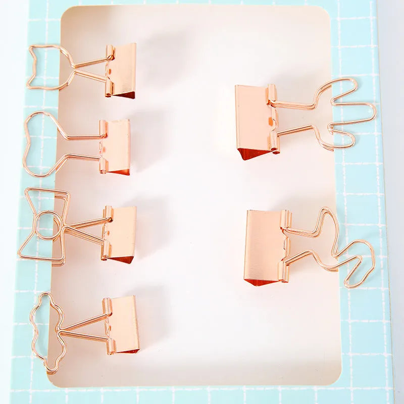 Gold-coloured metal alligator hair clip in a choice of flamingo, love, cloud, cat, cactus, or bow shapes.