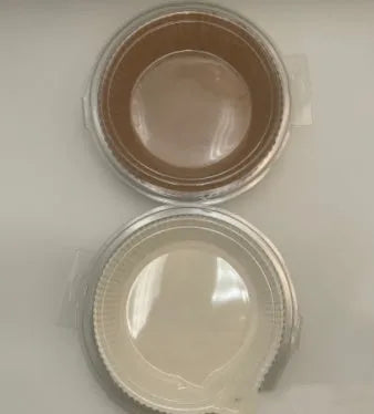 Round white disposable parchment paper liner for air fryer basket with raised edges.
