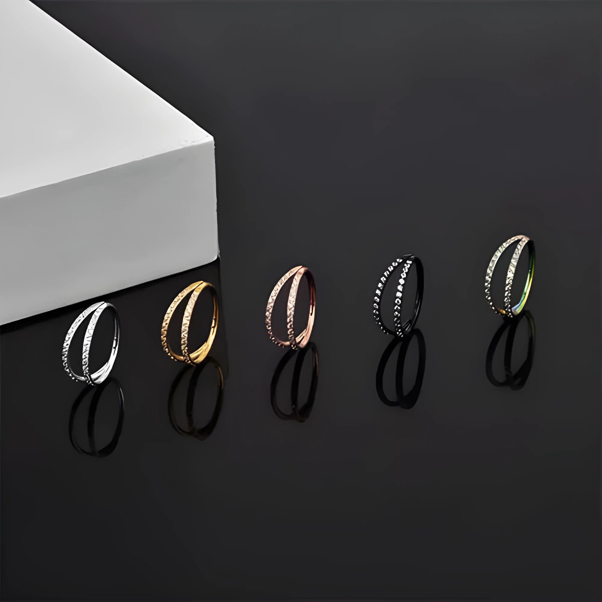 G23 titanium alloy nose ring with diamond finish in gold or steel colour, showing labret post design.