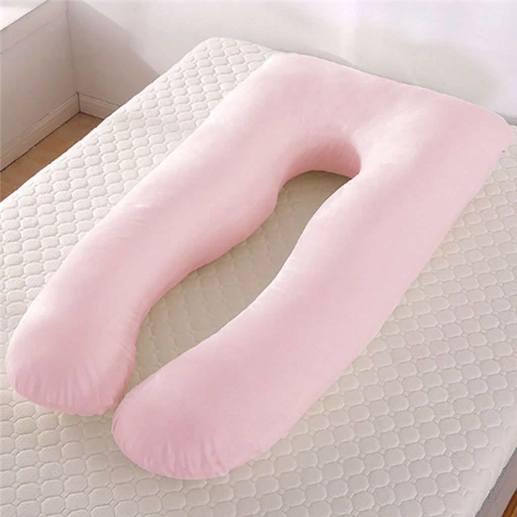 U-shaped pregnancy pillow in light blue ice silk fabric on a bed.