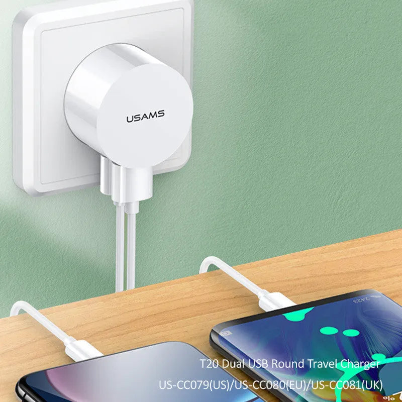 White universal USB phone charger with foldable US, UK, and EU plugs showing compact design