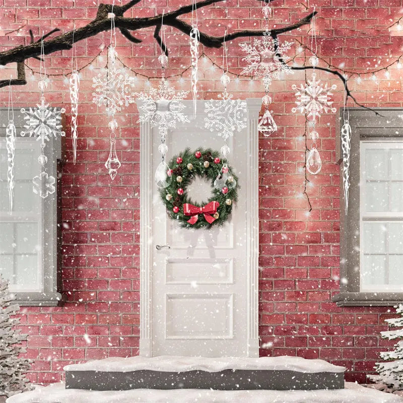 Set of ten clear acrylic icicle and snowflake Christmas ornaments with white hanging ribbons.