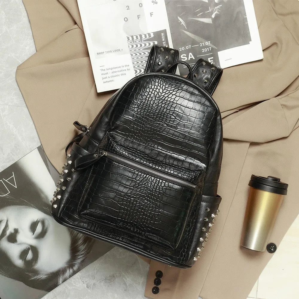 Black PU leather computer schoolbag with rivet detailing showing 36-55L capacity