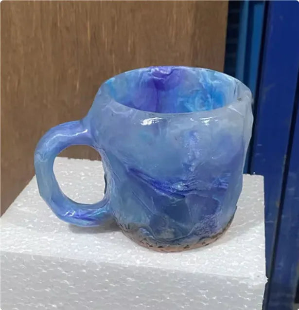 Purple resin mineral crystal coffee mug with handle showing 3D texture and 10cm height