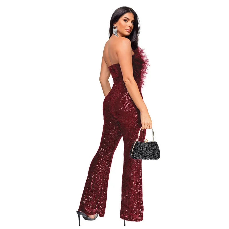 Women's black sleeveless backless jumpsuit with flared legs and sequin decoration